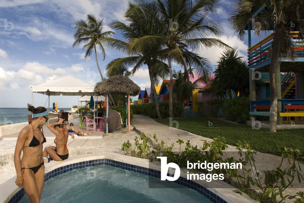 Tourists at swimming pool and spa of Hotel Compass Point Resort at Love beach Nassau, Bahamas, Caribbean, 2014 (photo)