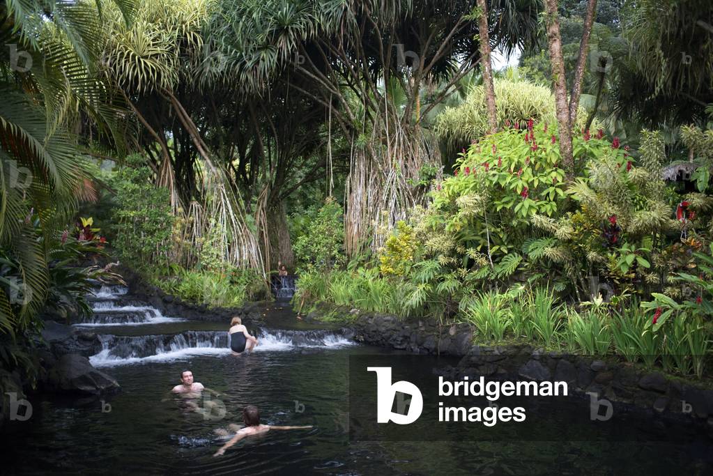Hot springs from the Arenel Vocano at the Tabacon Grand Spa, Costa Rica, Visitors enjoys one of the warm streams that flows through Tabacon Hot Spring Resort and Spa Costa Rica (photo)