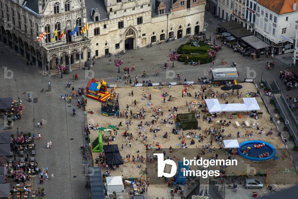 Artificial sand beach in front of Guild houses and City Hall in Mechelen main square, Grote Markt, Belgium (photo)