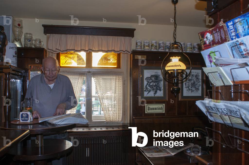 Zum Biermichel Traditional German Corner pub interior Senior elderly man in typical Local bar Table with stammtisch Berlin, Germany (photo)