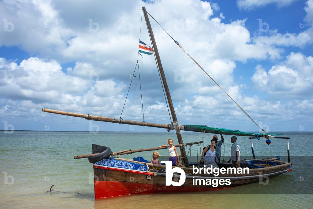 Tourists european family inside a dhow sailing boat in Manda island in Lamu archipelago in Kenya, 2020 (photo)