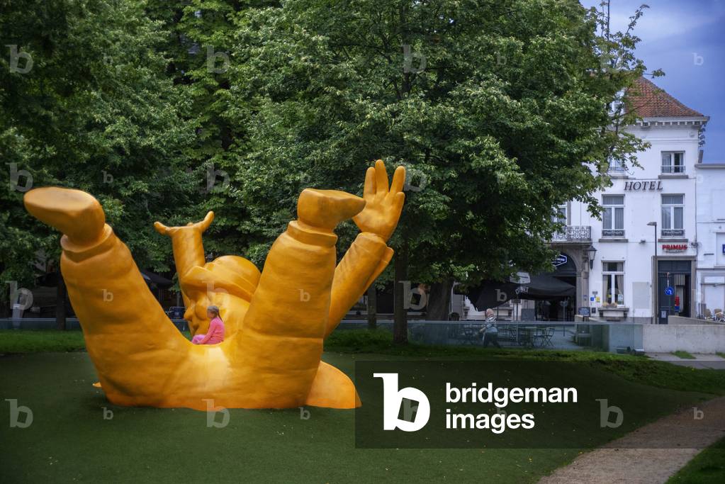 Giant statue of the local mascot named Opsinjoorke in Mechelen, Belgium (photo)