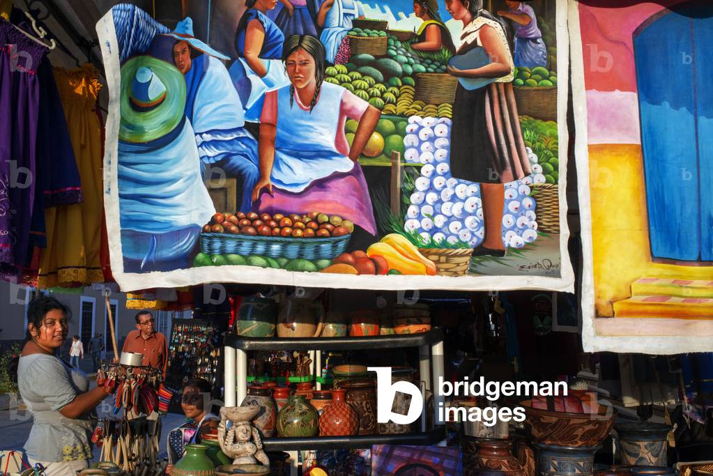 Local woman selling paints, arts, crafts and other souvenirs located in the central square of Granada, Nicaragua, Central America, America (photo)