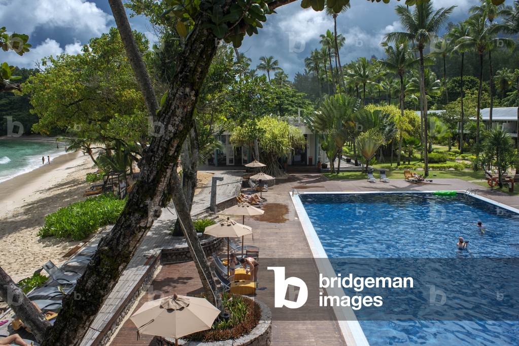 Tourists on the beach and the pool in The Baia at Avani Barbarons Mahe Seychelles (photo)