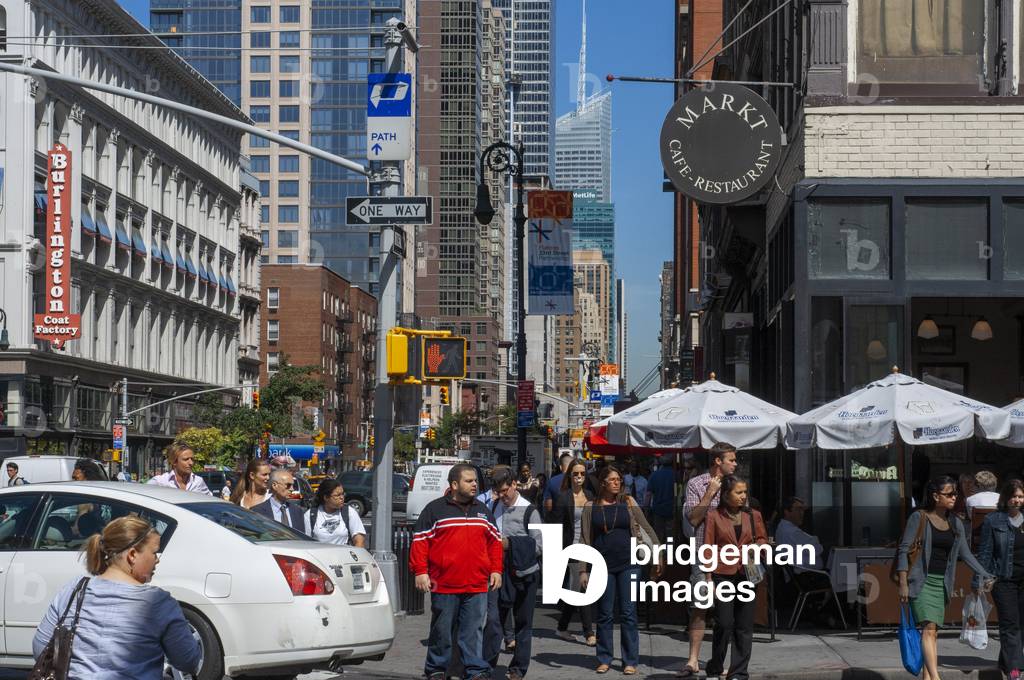 Pedestrians crossing street in crosswalk at W 21st Street and 6th Avenue Chelsea, New York, USA (photo)