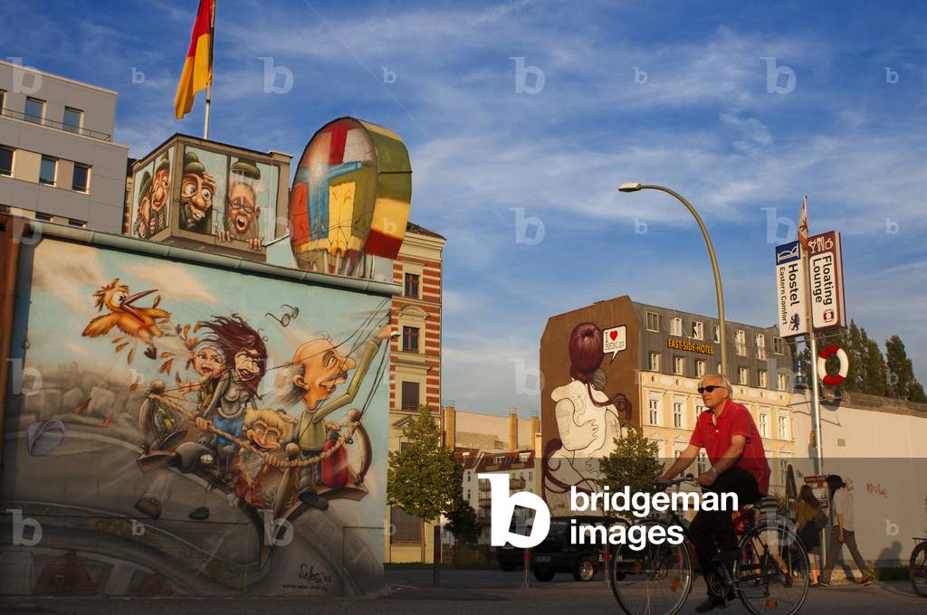 Graffiti on original section of Berlin Wall at the East Side Gallery in Friedrichshain Berlin, Germany (photo)