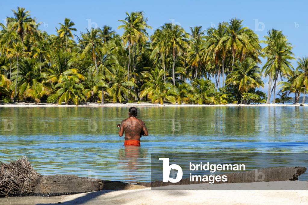 Island of Taha'a, French Polynesia, A local boy plays the ukulele to woo your girl at the Motu Mahana, Taha'a, Society Islands, French Polynesia, South Pacific, 2020 (photo)