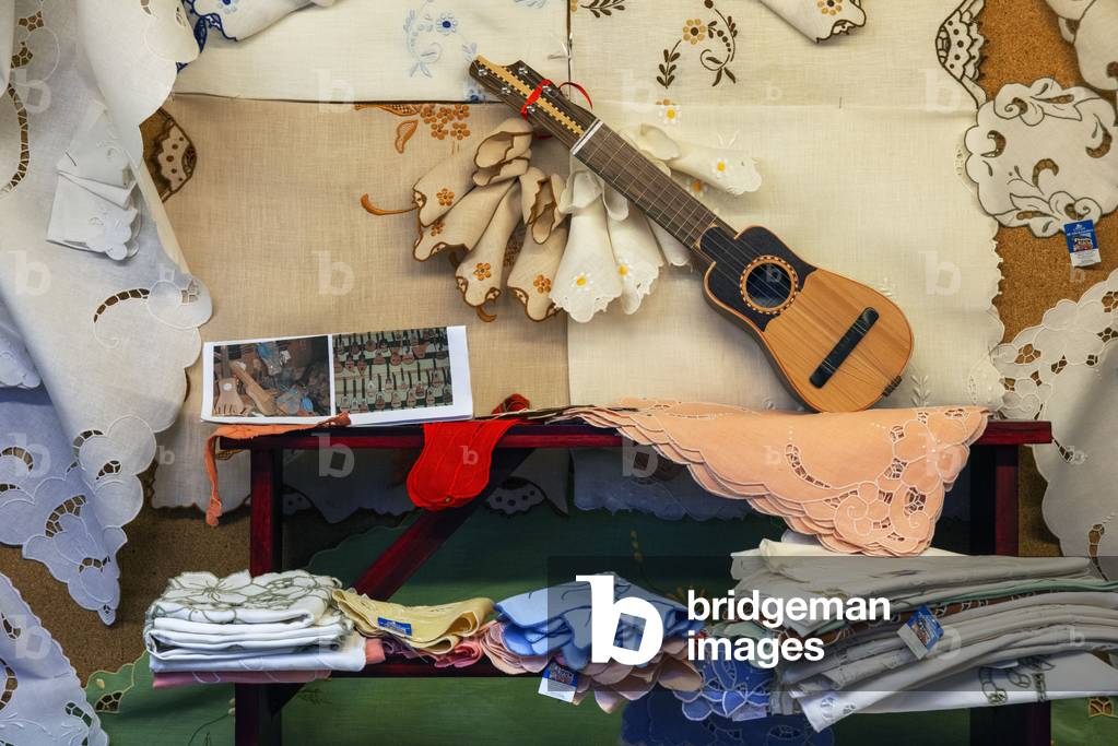 Traditional canary timple guitars and clothes dress and souvenirs in Casa de los Balcones shop, historic building, built in 1692 in La Orotava Tenerife Island Canary Islands Spain (photo)