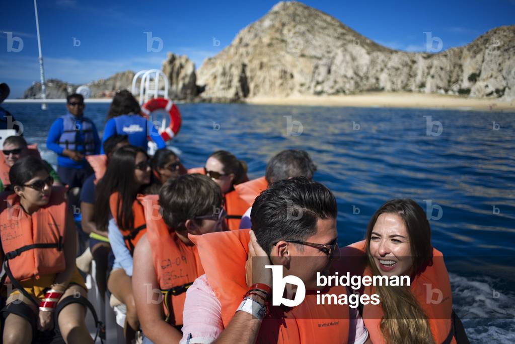 Tourists in a boat excursion in front of Divorce beach in Los Cabos, Sea of Cortez, Baja California, Mexico (photo)