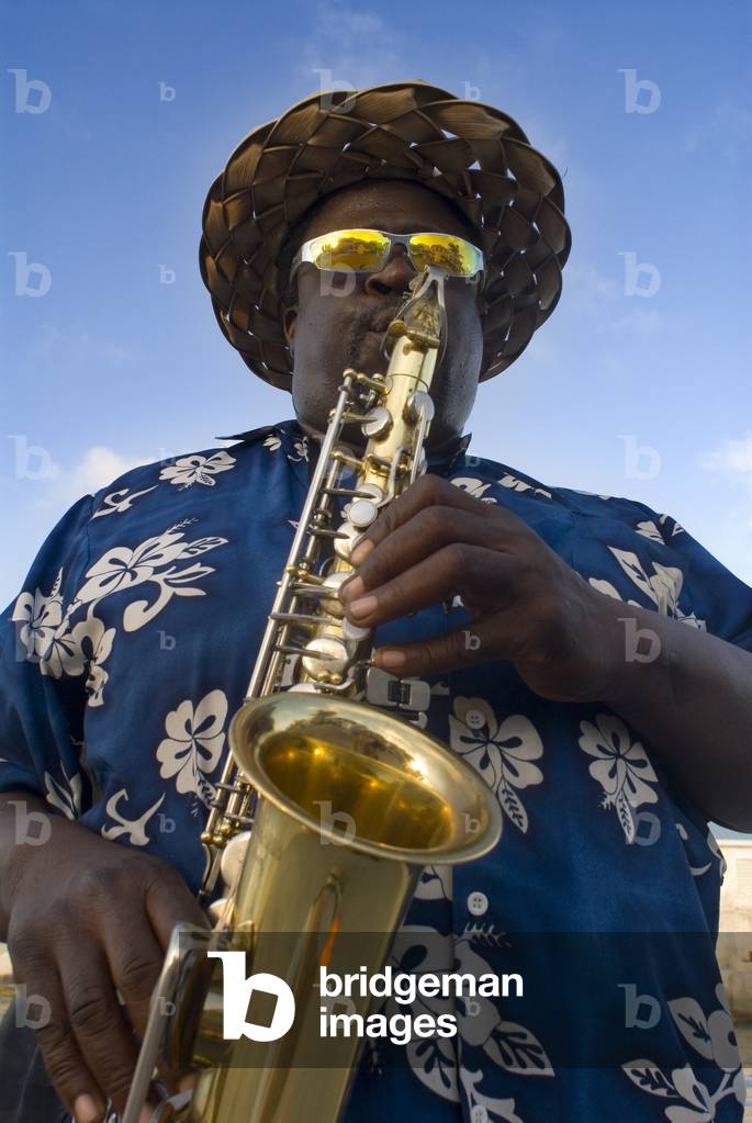 Musician playing the saxophone near of the port of Nassau, New Providence Island, Bahamas, Caribbean (photo)