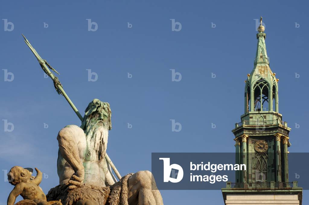 Neptune fountain in front of the St. Mary Church or Marienkirche in Mitte in Berlin, Germany (photo)