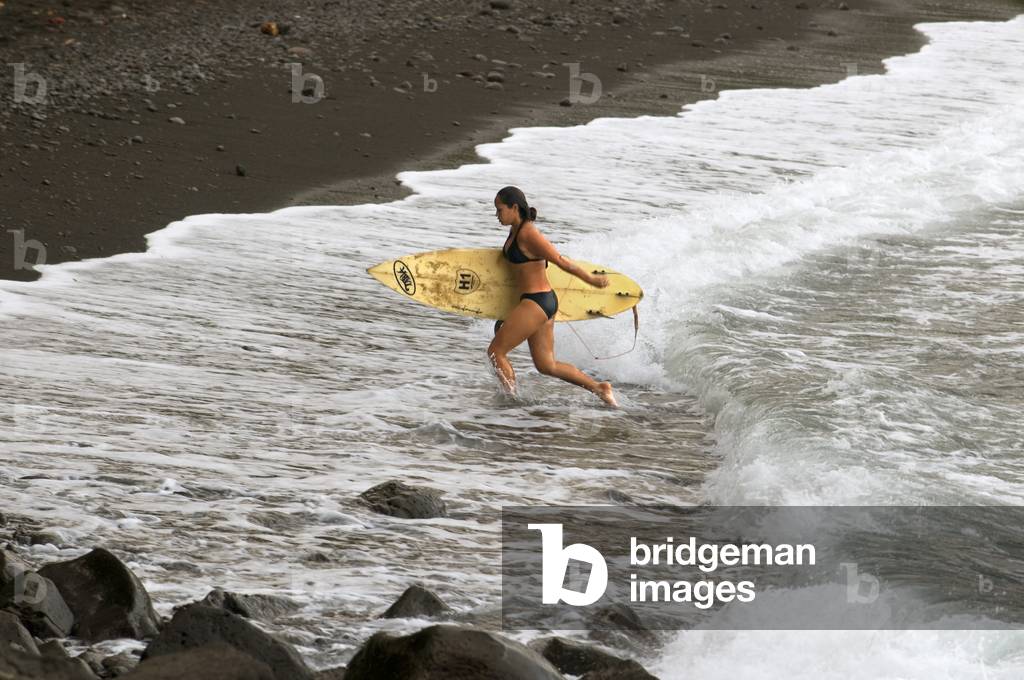 Surfer at Honoli'i Beach, Big Island, Hawaii (photo)