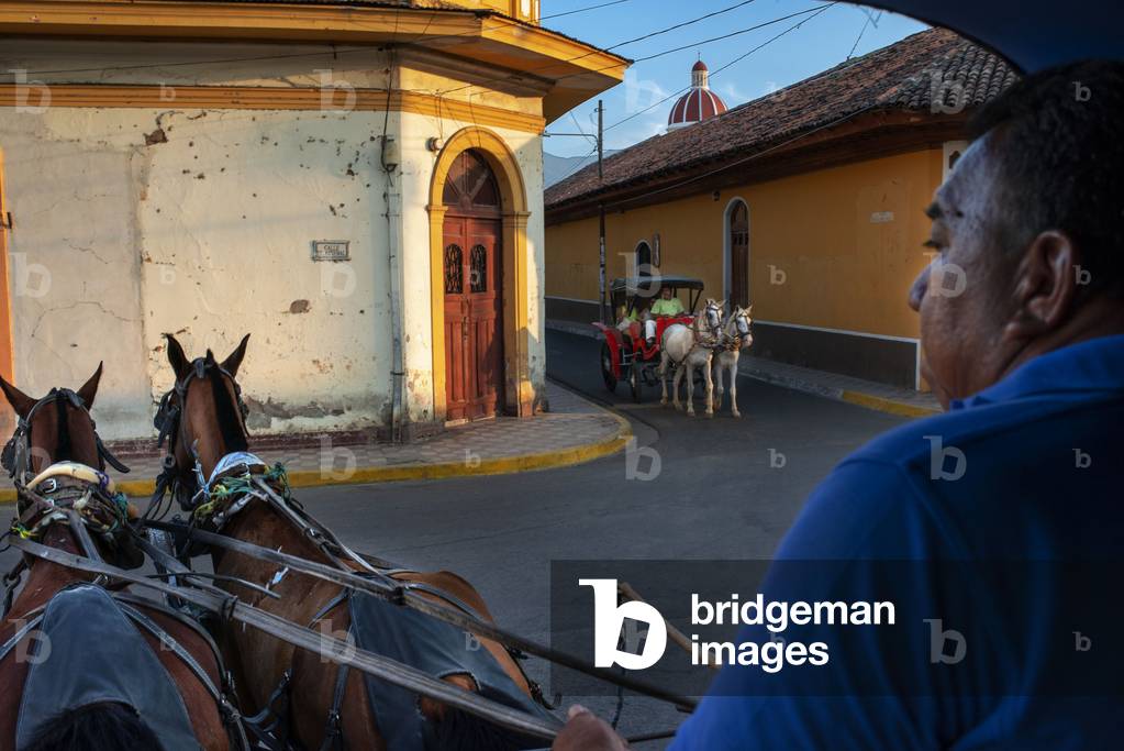 Horse drawn carriages next to Central Park the main plaza in the Spanish colonial city of Granada Nicaragua, Central America, America (photo)