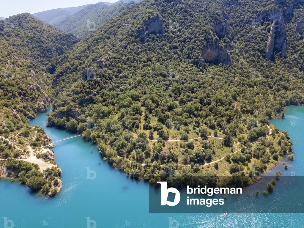 Congost de Mont-Rebei in the Pre-Pyrenees of Lleida, Catalonia, Serra del Montsec, La Noguera, Lleida, Spain

The Montrebei Gorge (in Catalan Congost de Mont-Rebei) is a place that is located between the provinces of Huesca and Lérida (Spain), between the regions of Ribagorza and Pallars Jussà, It is constituted in the narrowest part by which the Noguera Ribagorzana river, which constitutes the natural border between Aragon and Catalonia, crosses the Montsec mountain range, walls in vertical fall of more than 500 meters and a width at its minimum point of 20 meters , The Catalan part is part of the Noguera Nature Reserve, It is within the Sierra del Montsec Natural Interest Area, 2020 (photo)