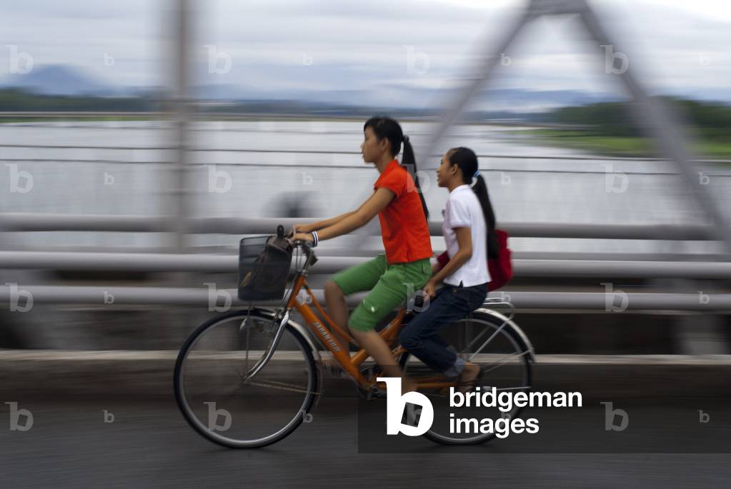 Vietnam Bicycling Over Bridge The Purfume River Hue (photo)