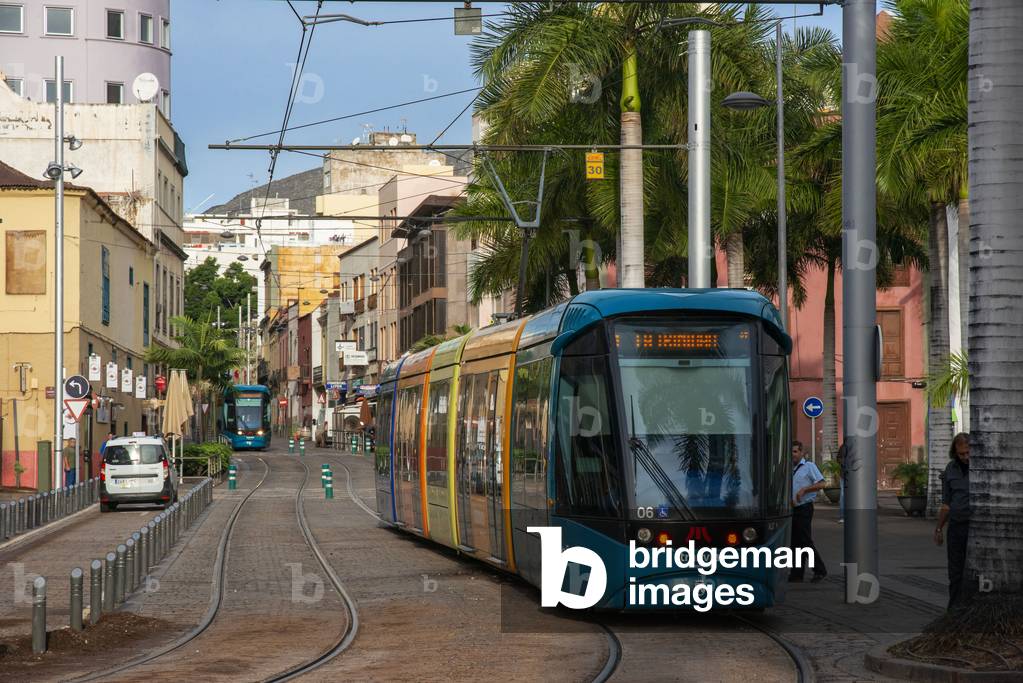 Modern tram operating between cities of La Laguna and Santa Cruz approaching Intercambiador (main station) in Santa Cruz de Tenerife Canary Islands, Spain (photo)