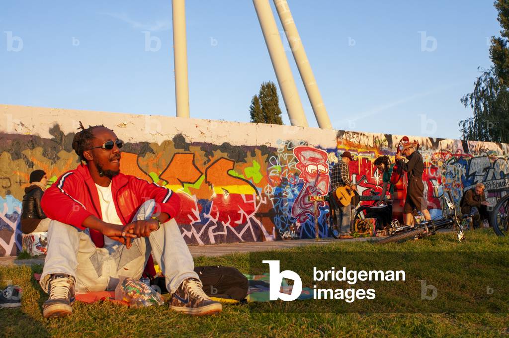A former part of the Berlin Wall death strip, Graffiti on Mauerpark wall in Berlin, Germany.  (photo)