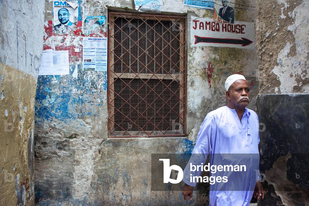 Local people in the narrow strees of the city town of Lamu island in Kenya, 2020 (photo)