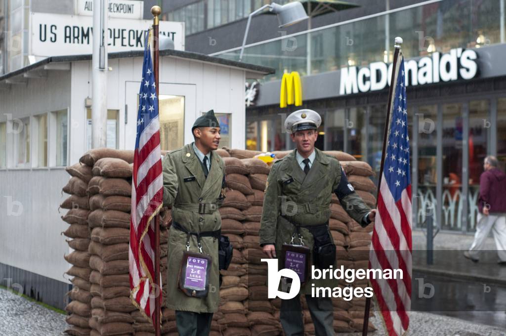 Checkpoint Charlie US Army checkpoint and guardhouse reconstruction at the former crossing point between East and West Berlin in Berlin, Germany (photo)