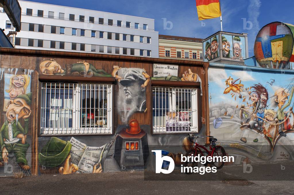Graffiti on original section of Berlin Wall at the East Side Gallery in Friedrichshain Berlin, Germany (photo)