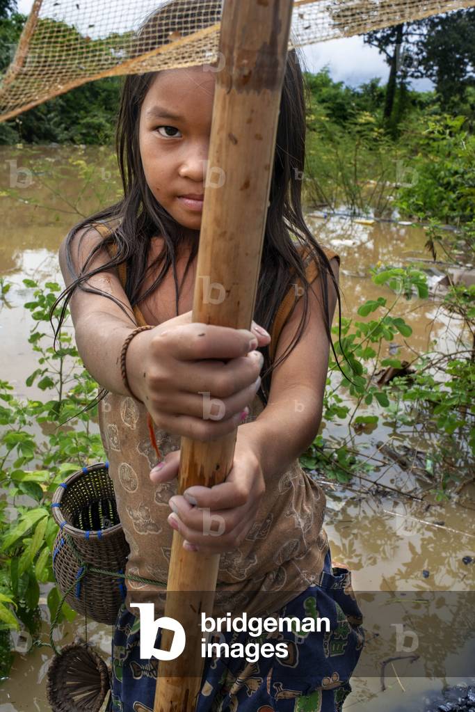 Traditional fishing with a net in the Ham Hinboun River in Savannakhet, Laos, Southeast Asia (photo)