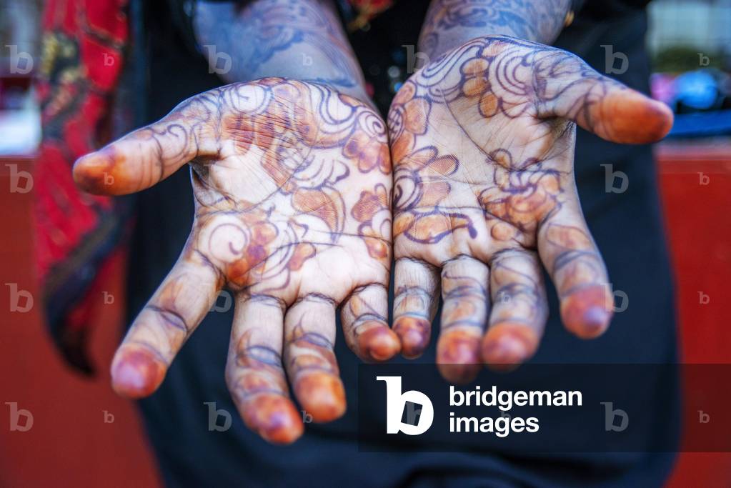 Woman shows Hand Palm Painted With Henna And Indigo in Lamu, Lamu Archipelago, Kenya, 2020 (photo)