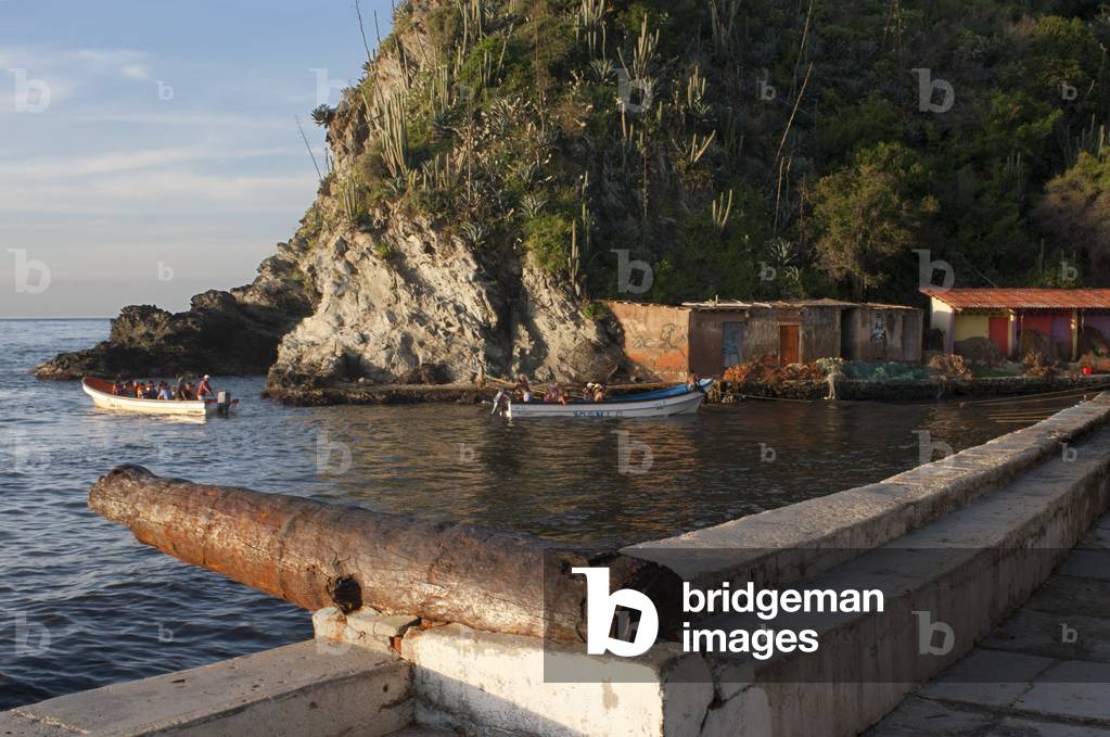 Malecon and cannon in Choroni beach in Falcon state in Venezuela - Henri Pittier National Park, in Venezuela.  (photo)