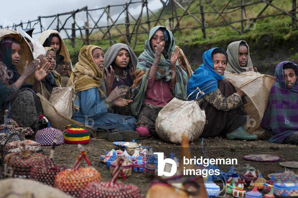 Local villagers selling hats and pots souvenir in the Simien Mountains National Park, Amhara Region, Ethiopia  (photo)