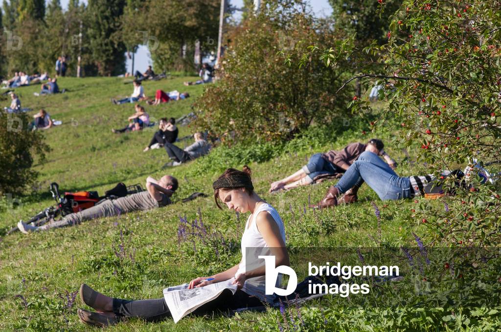 People enjoy at Mauerpark Prenzlauer Berg in, Berlin, Germany (photo)