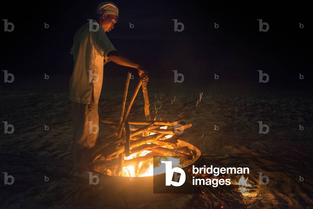 Fire for a barbecue in the beach of The Residence Hotel in Zanzibar island a semi-autonomous part of Tanzania, East Africa (photo)