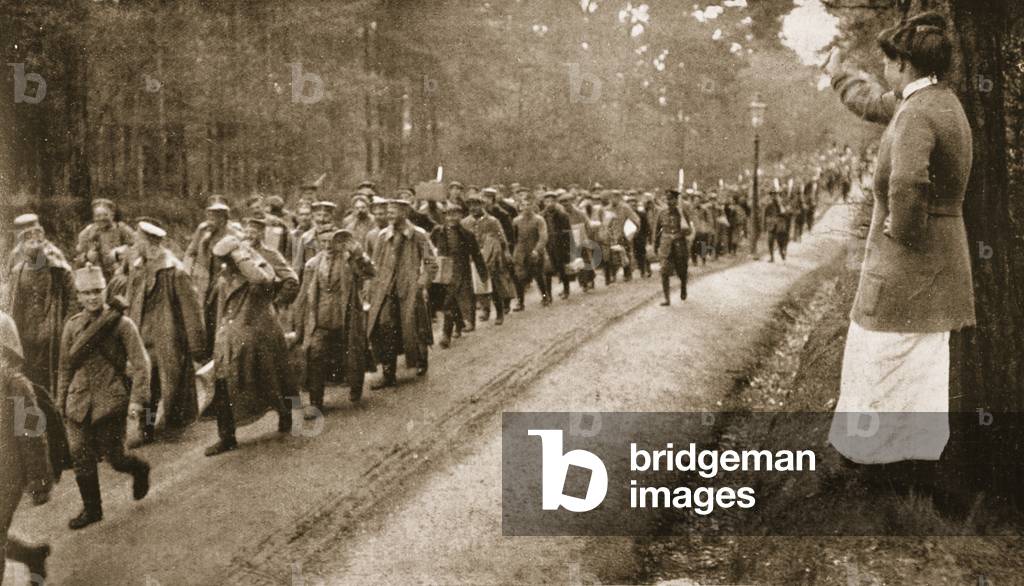Amused at a woman facetiously shaking her fist: German prisoners captured at Neuve Chapelle under escort near Aldershot, from 'The Illustrated War News' (b/w photo)