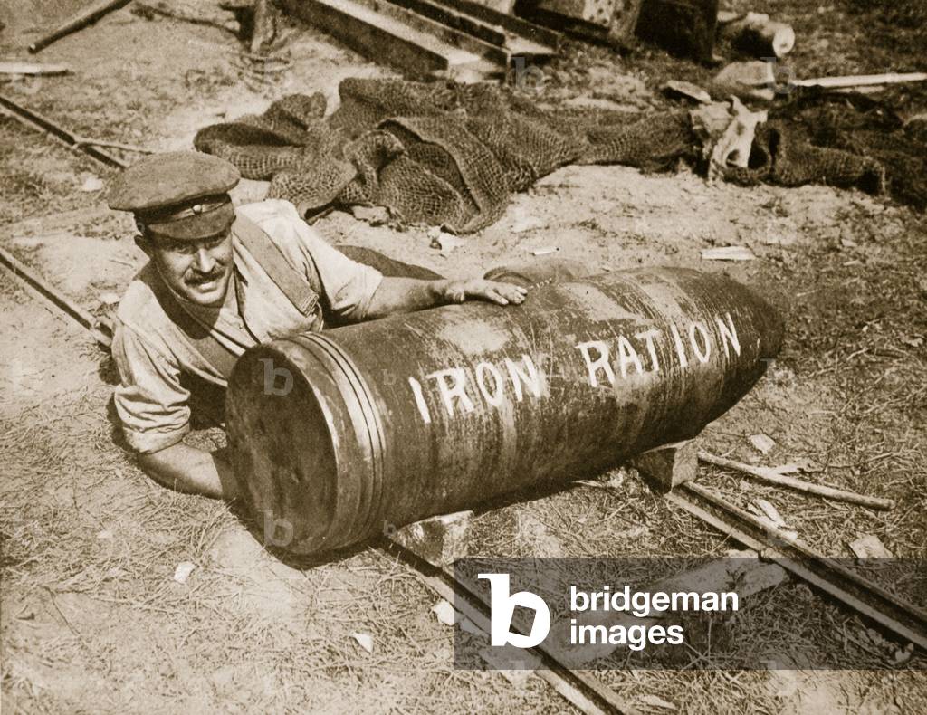A huge shell, weighing 1,400lb., ready to be fired by the 15-inch howitzer, or 'Grandmother' as it is called, 1916 (sepia photo)