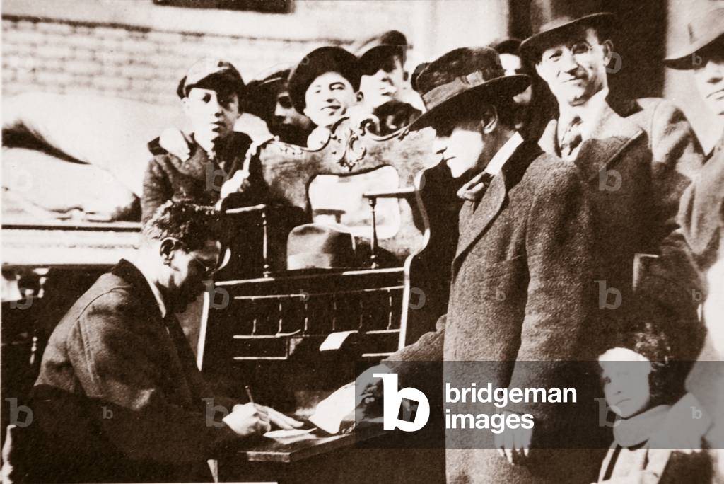 Head of the Anti-Rent League enrolling new members in New York early 1919 (sepia photo)