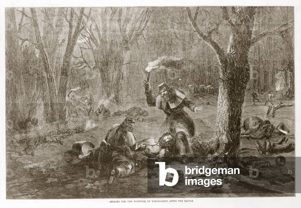 Seeking for the wounded, by torchlight, after the battle, from Harper's Weekly, pub.1862 (engraving)