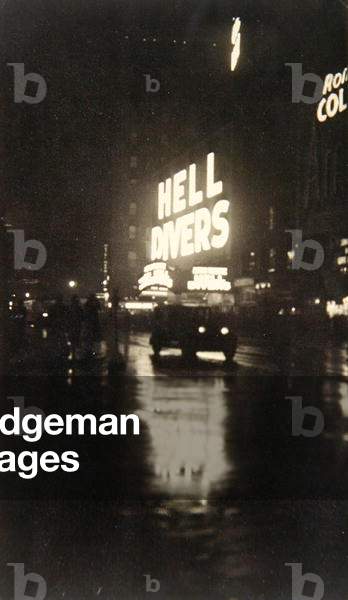 A New York street at night, 1932 (b/w photo)