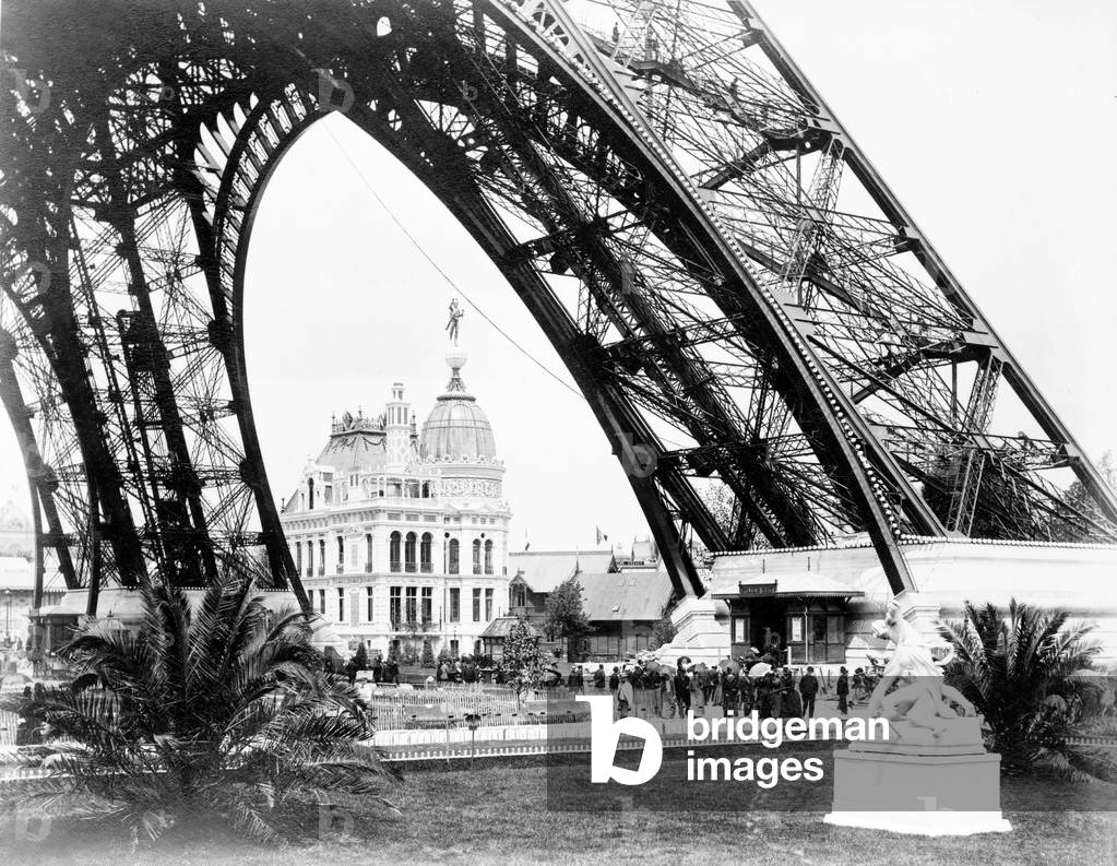The Gas Pavilion seen through the base of the Eiffel Tower, Paris Exhibition,  1889 (b/w photo)