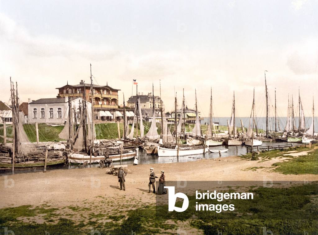 Fishing boats moored in Busum with several spa hotels in background, Schleswig-Holstein, Germany, pub. c.1895 (postcard chromolithograph)