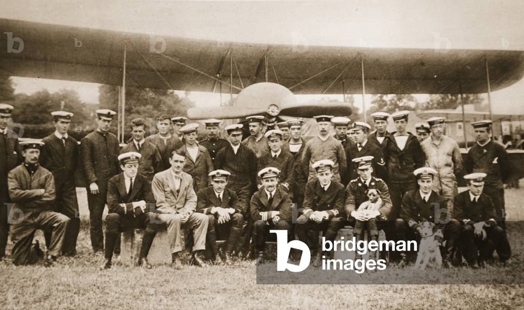 British Naval Airmen distinguished in the War: Officers of the Naval wing of the R.F.C. with their mechanics, from 'The Illustrated War News', 1916 (sepia photo)