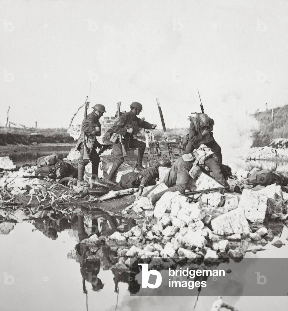 Our fearless men fighting agains great odds, mine the bridges and retire across the Crozat Canal, 1918 (b/w photo)