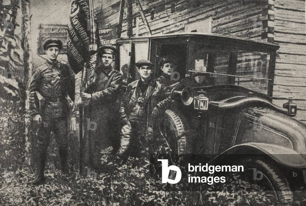Workers of the 'respirator' factory delivering a banner with the inscription 