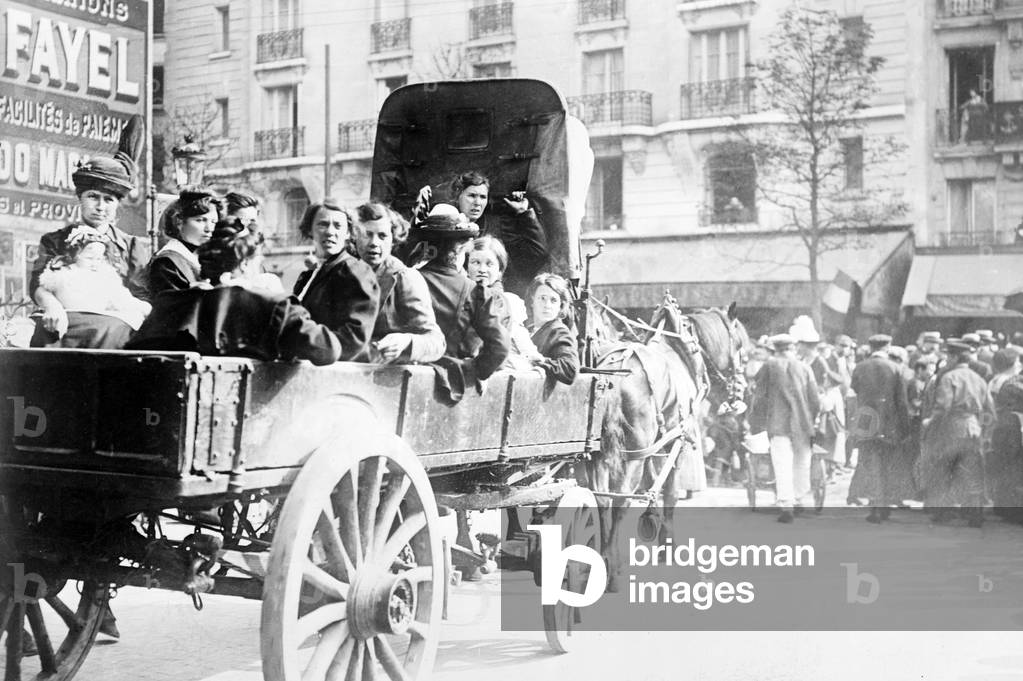 Refugees fleeing Belgium in a horse drawn wagon, Paris, 1914 (b/w photo)