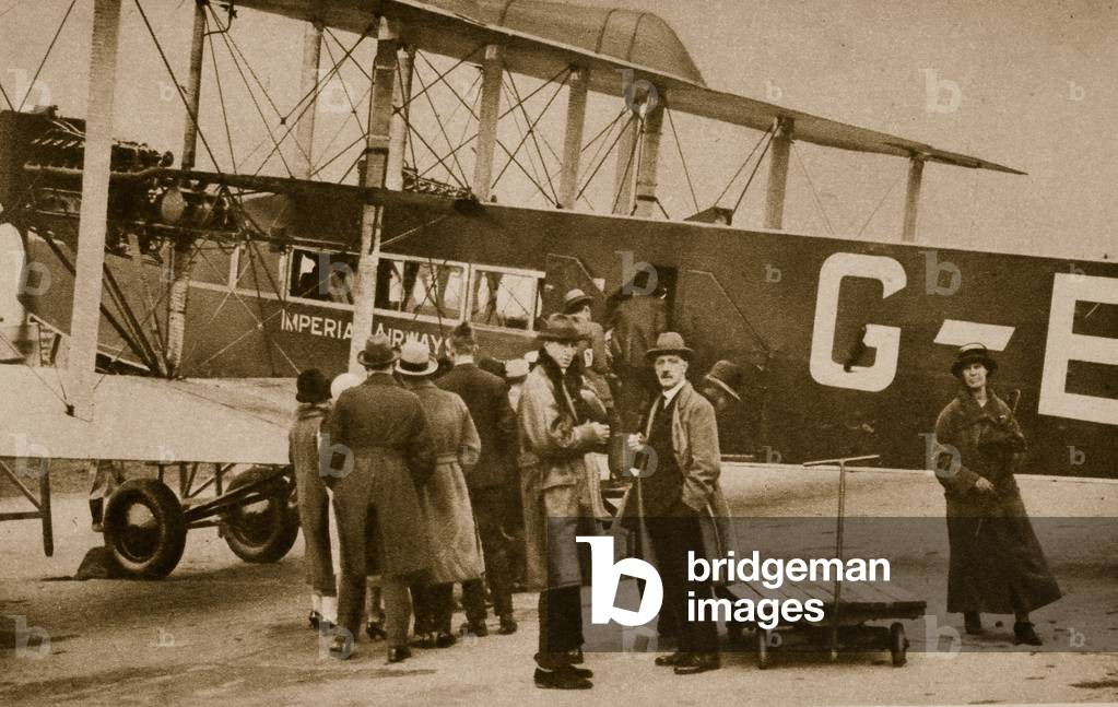 Passengers embarking for Paris by an Imperial Airways craft (sepia photo)
