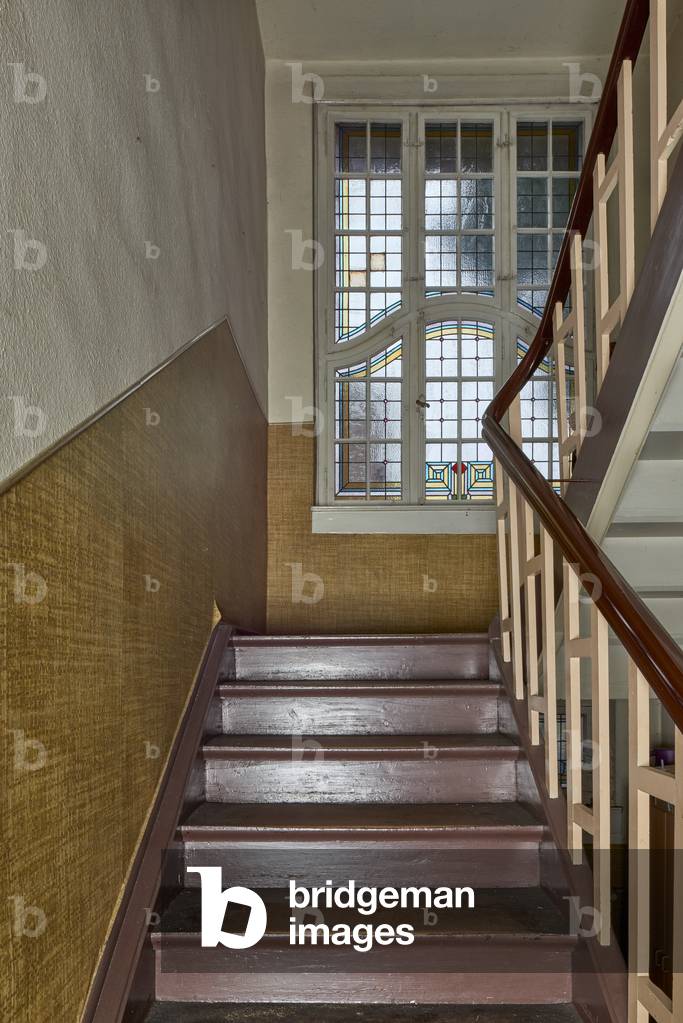Staircase in the former presbytery with stained glass window, Eich (colour photo)