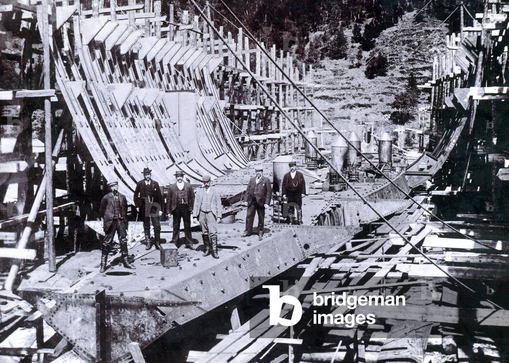 Showing the ice breaking ferry 'SS Baikal' partially framed during re-erection in Russia, 1896 (b/w photo)