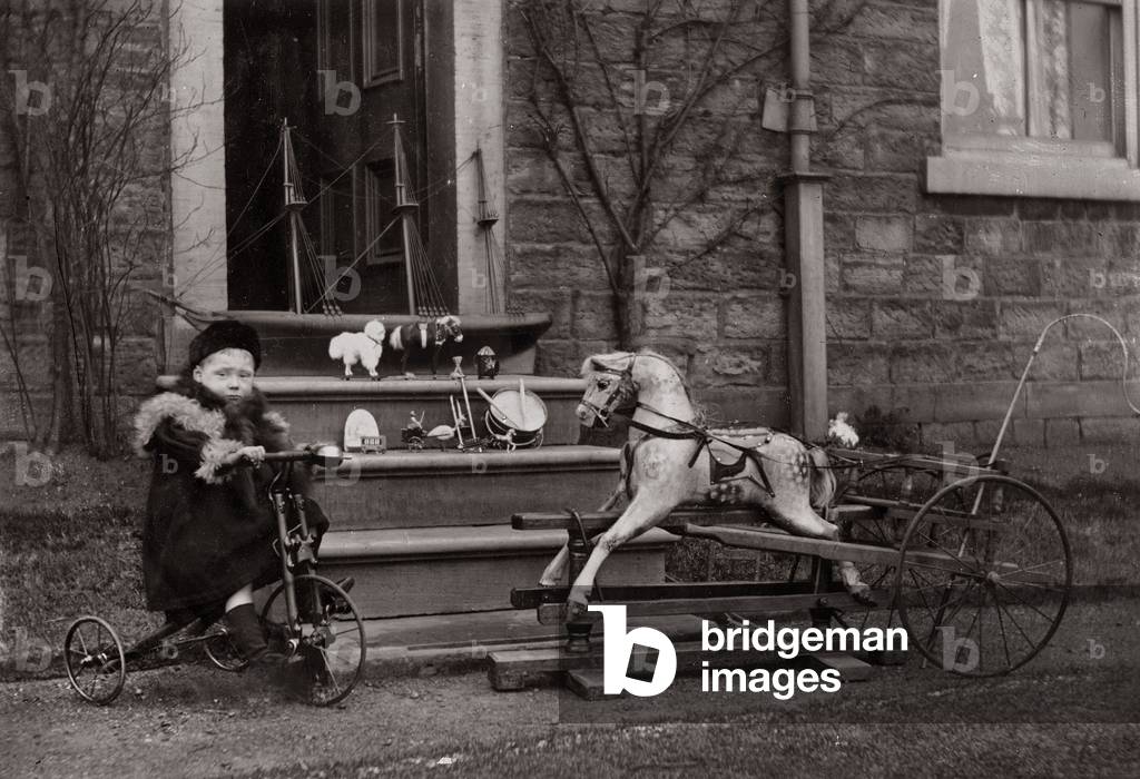 Portrait of a child on a tricycle, c.1882-1900 (b/w photo)