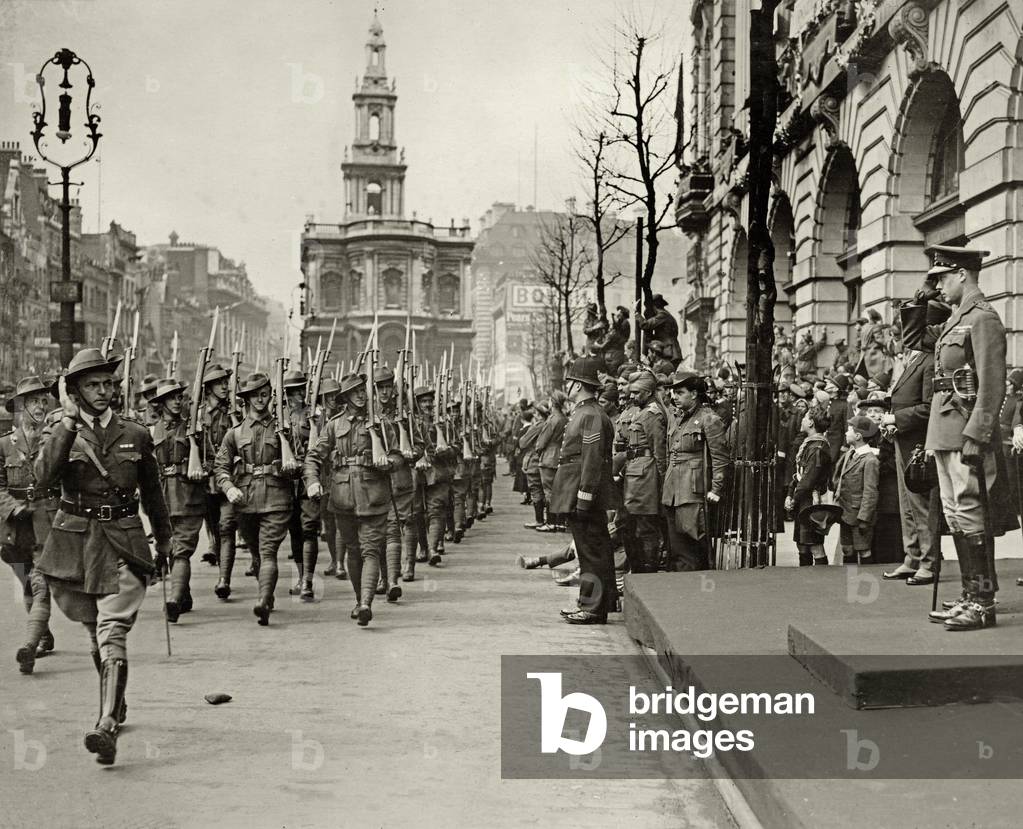 The Prince of Wales taking the salute of Australian troops outside Australia House, during the Peace Day procession, 1919 (b/w photo)