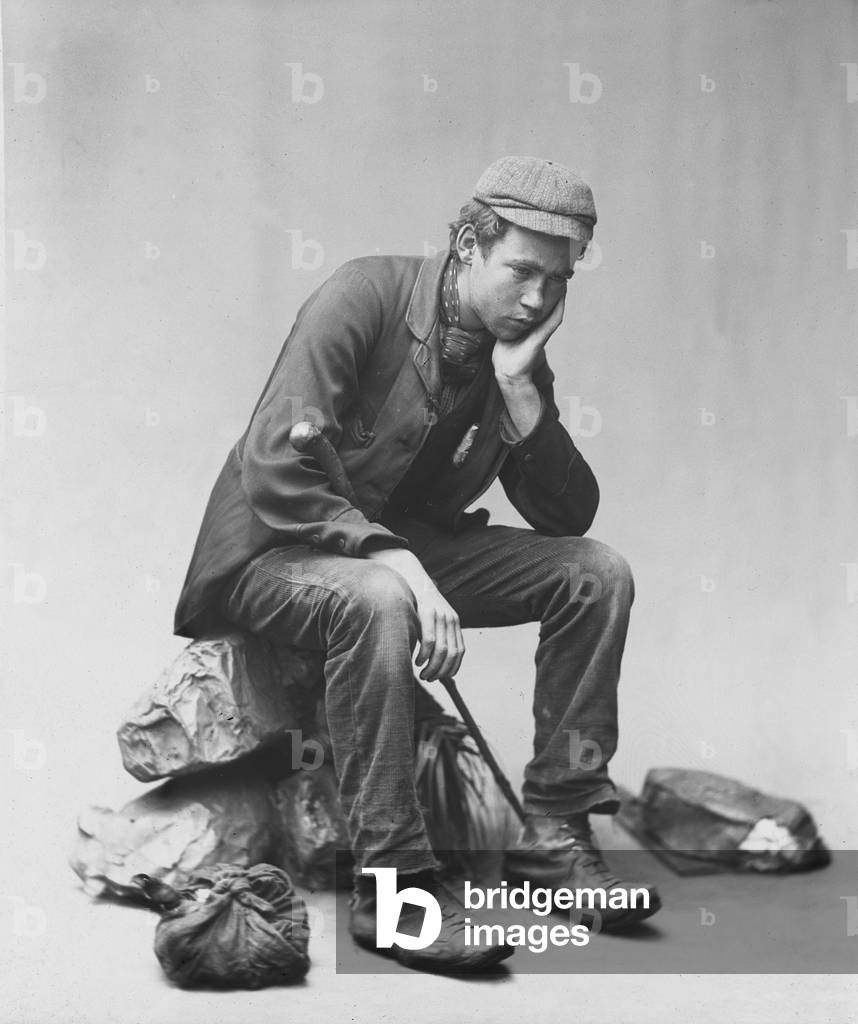 Studio portrait of a young traveller (b/w photo)