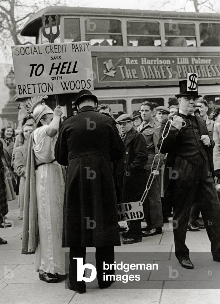 A curious policeman wants to know the names of the Anti-Bretton Woods demonstrators, 12th December 1945 (b/w photo)