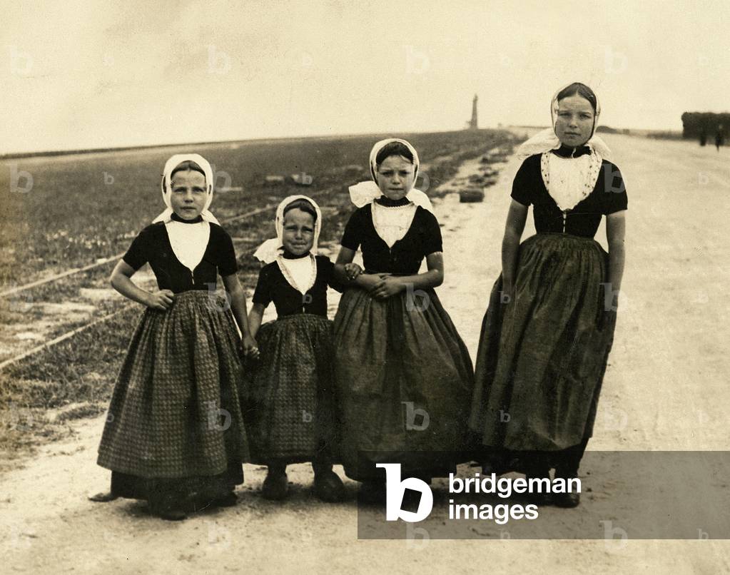 You can't beat the Dutch for quaint costumes - these four youngsters were photographed on the dyke at Westkapelle, Netherlands, early 20th century (b/w photo)