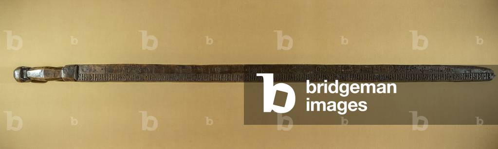 Runic calendar. Stick in alder wood, incised with sign knife and characters imitated from runes, indicating the days of the week, the feasts of the saints and the important dates of the year. Sign “” A S”” (owner's initials) and date 1566. Origin Finland. Saint Genevieve Library, Paris